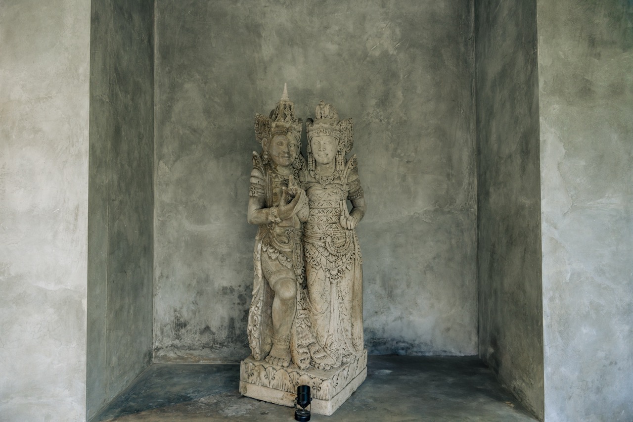 Villa entrance showing parking convenience with decorative statues